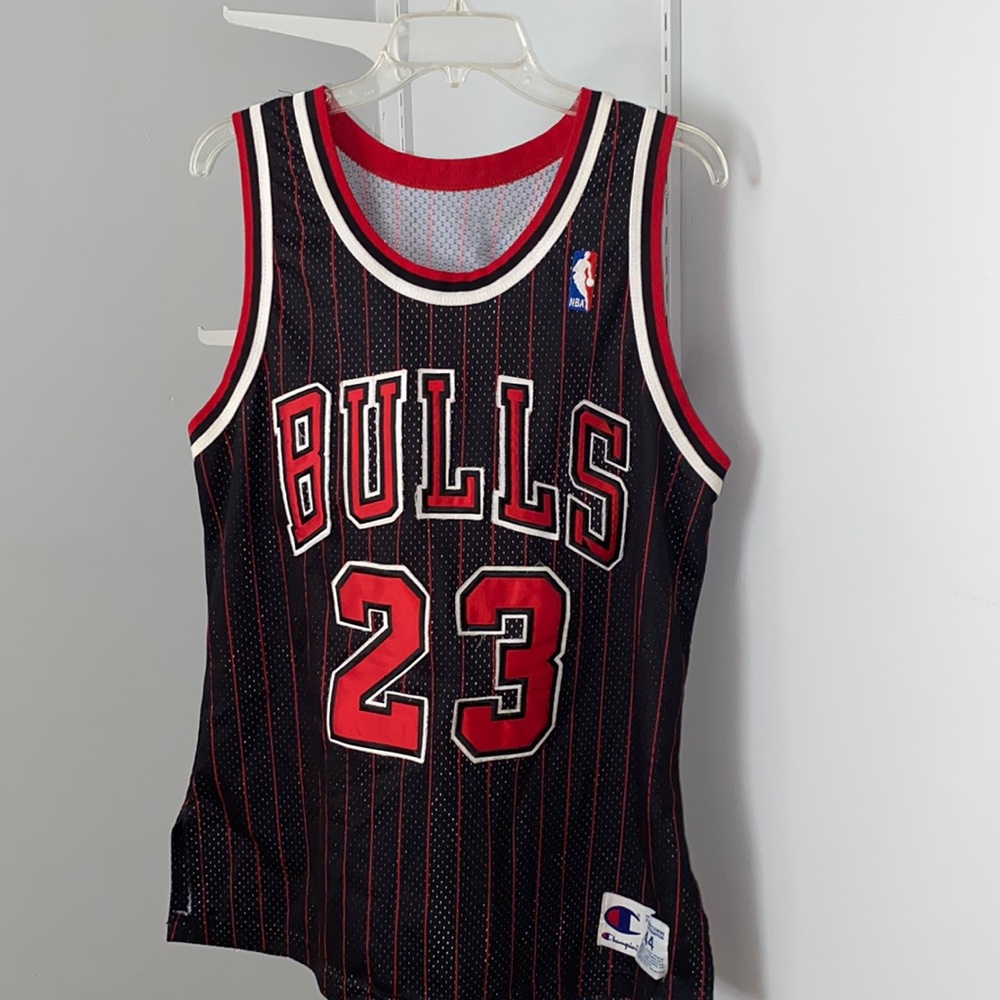 COPY - Bulls Jersey #23 worn by Michael Jordan. With black background and white…